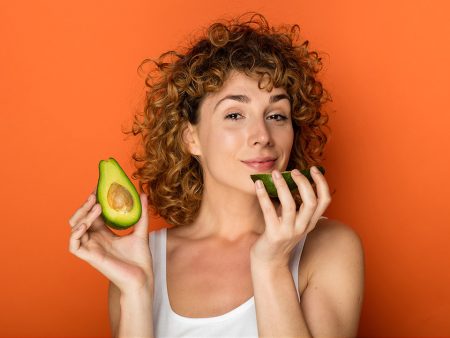 woman eating avocado