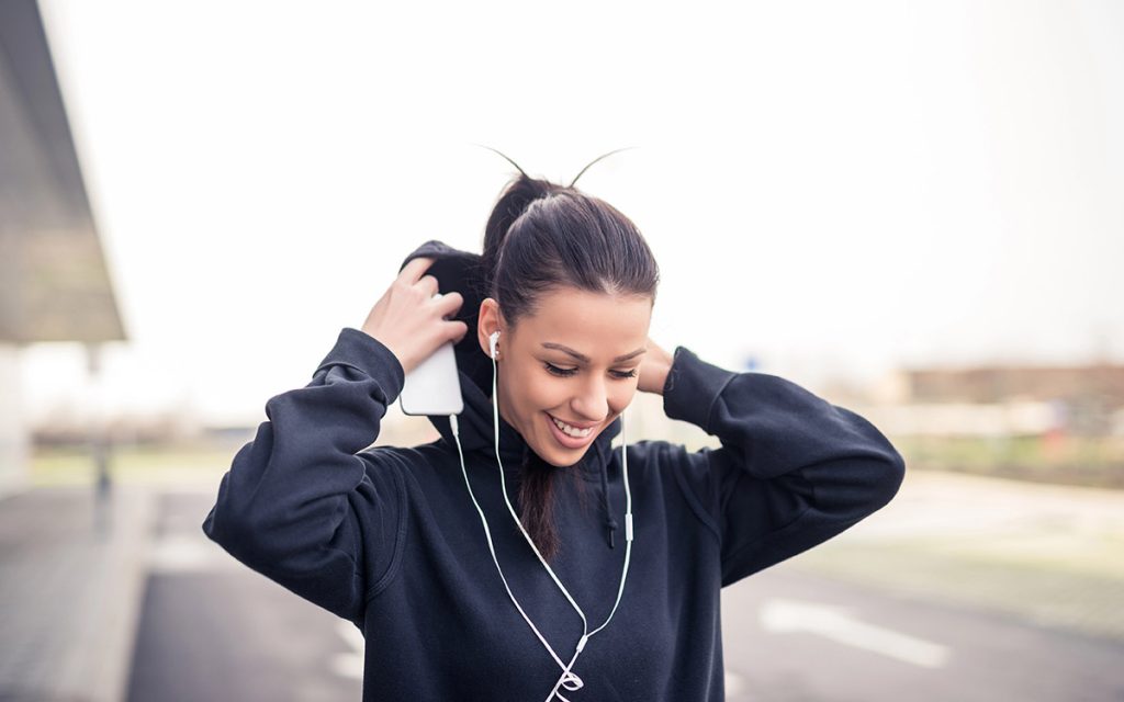 woman with hoodie smiling