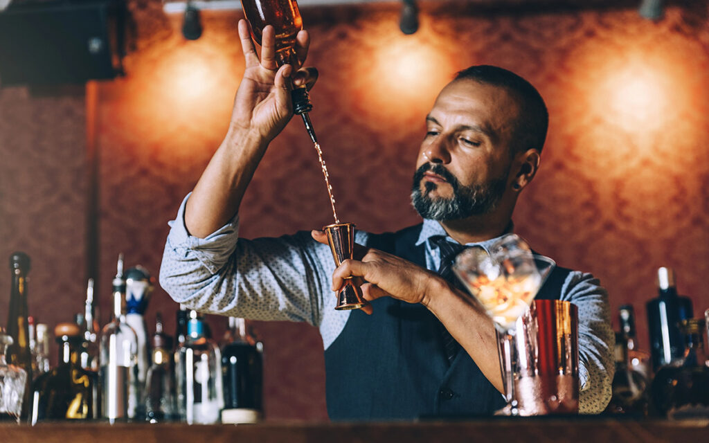 mixologist working on cocktails